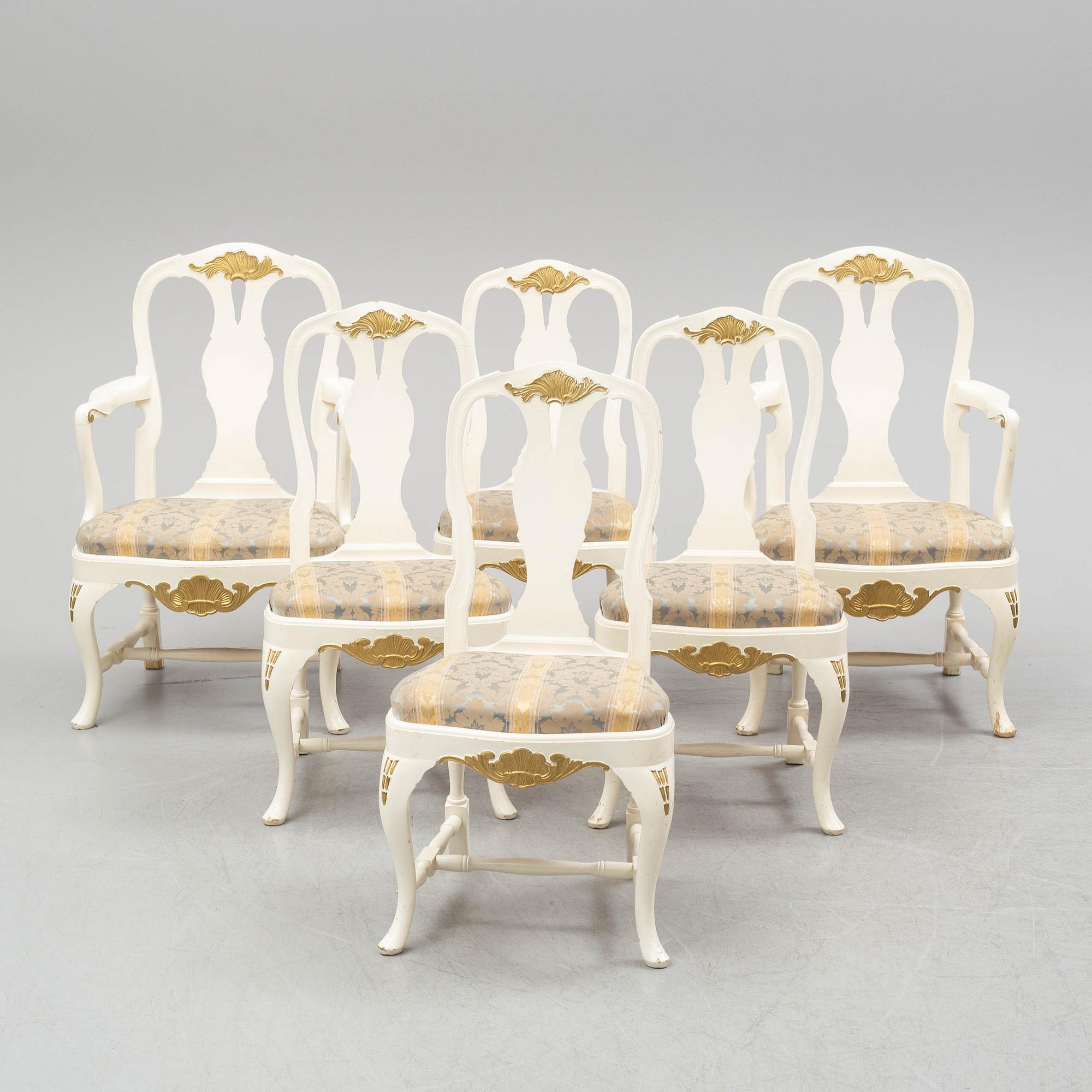 A dining table and six chairs, rococo style, mid 20th century.