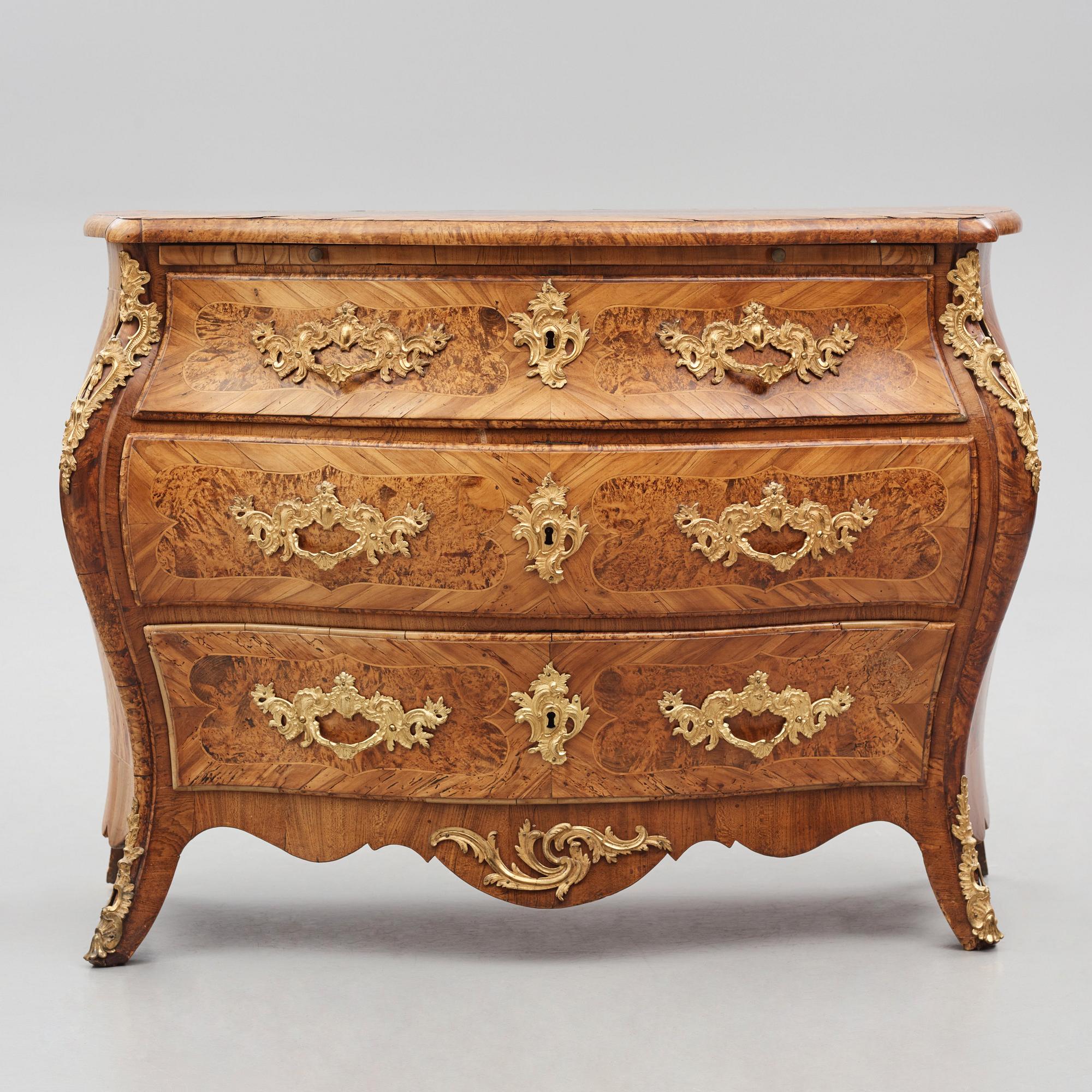 A burr-alder and gilt brass-mounted rococo commode by J. Sjölin (master 1767-1785).