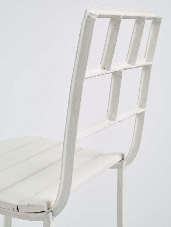 Carl Hörvik, a pair of white lacquered iron garden chairs, possibly manufactured by Thulins vagnsfabrik, Sweden.