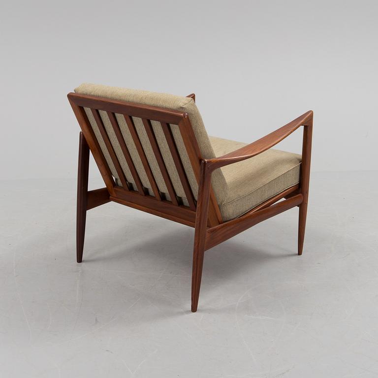 a 1960s teak "Kandidaten" armchair designed by IB Kofod Larsen for OPE Möbler, Jönköping.