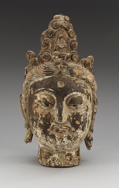 A Yuan/Ming style sculptured and painted wood head of Bodhisattva Guanyin, possibly Ming dynasty (1368-1644).