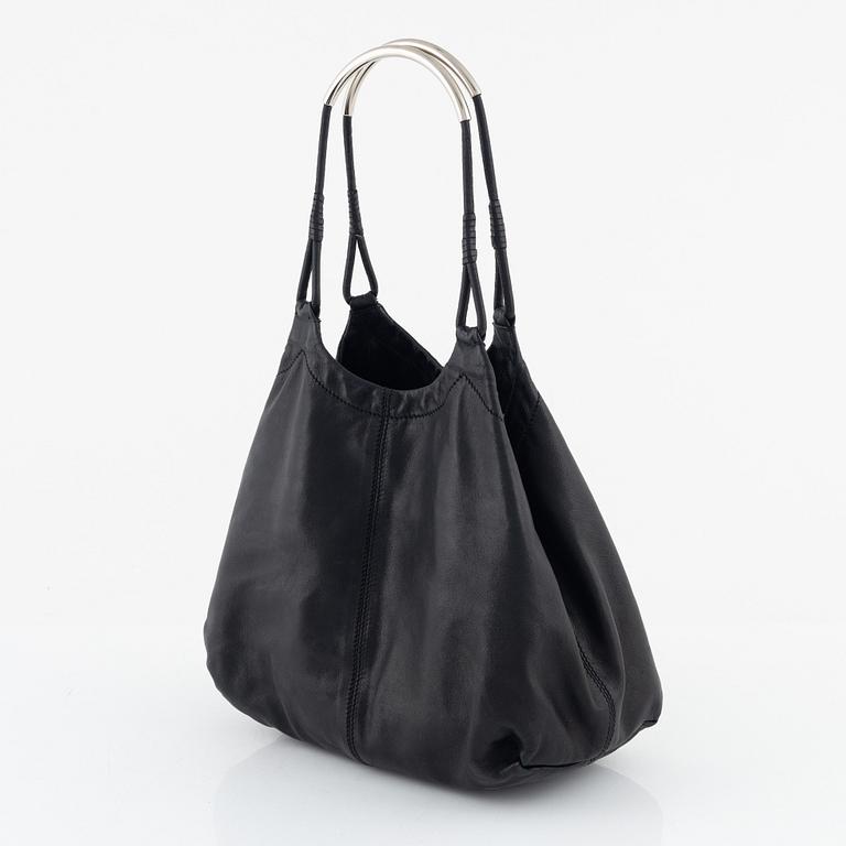 Prada, A black leather bag.