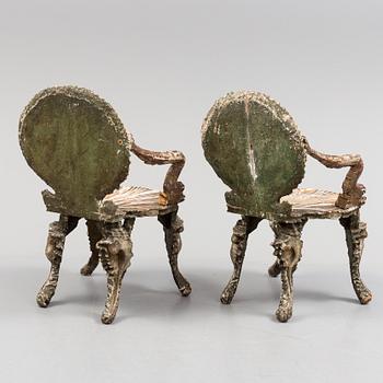 A pair of 20th century grotto armchairs.