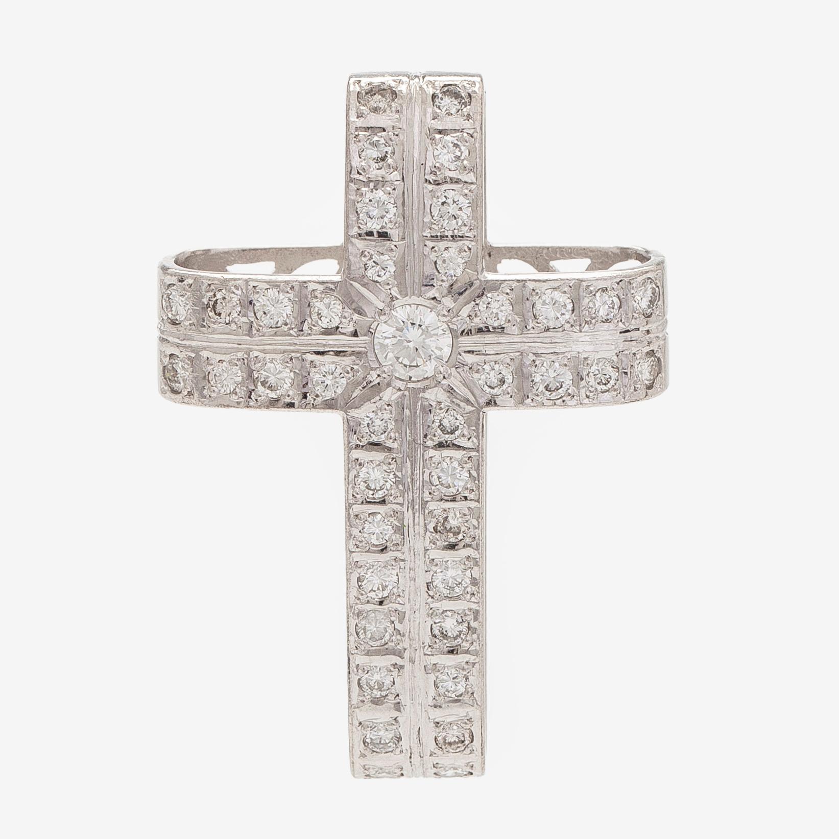 An 18K white gold cross pendant with diamonds.