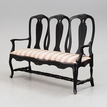 A mid 1900s rococo style sofa.