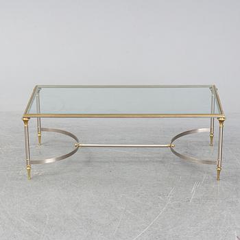 A 1970s sofa table, brass and glass.
