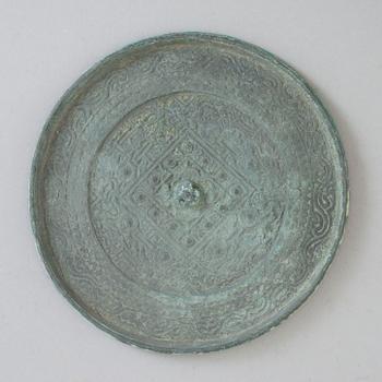 A bronze mirror, Xin-Eastern Han dynasty (9-220).