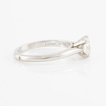A Cartier ring in platinum with a round brilliant-cut diamond 0.91 ct according to the engraving.
