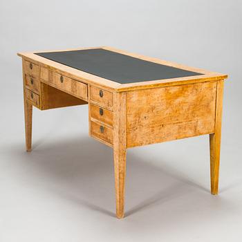 A late 19th-century curly birch veneered writing desk.