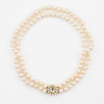 A two strand cultured freshwater pearls necklace, clasp 18K gold with an aquamarine.