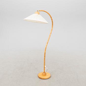 A Markslöjd 21st century wooden floor lamp.