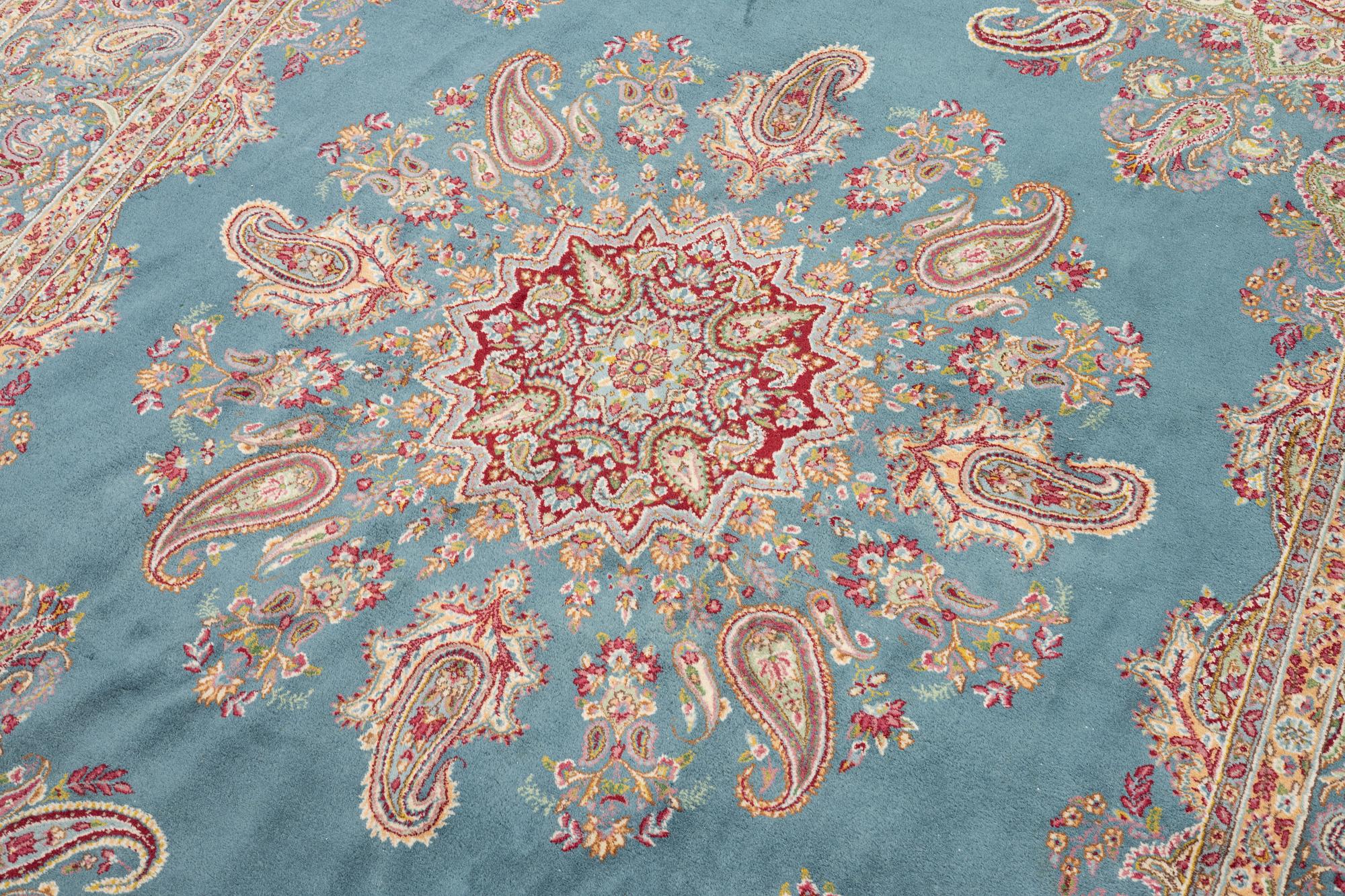 A Kirman carpet, c. 335 x 232 cm.