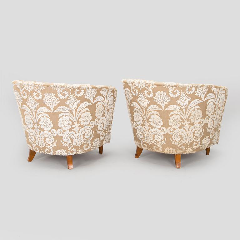A pair of mid-20th century armchairs.