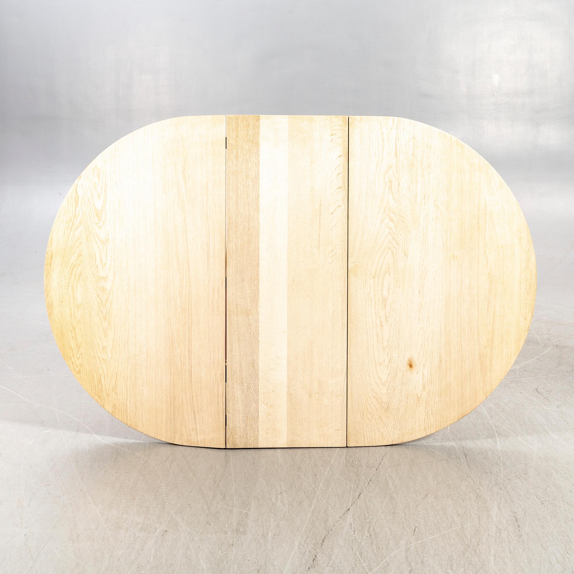 A 20th century oak folding table.
