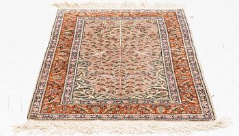 An oriental rug, c. 135 x 85 cm.