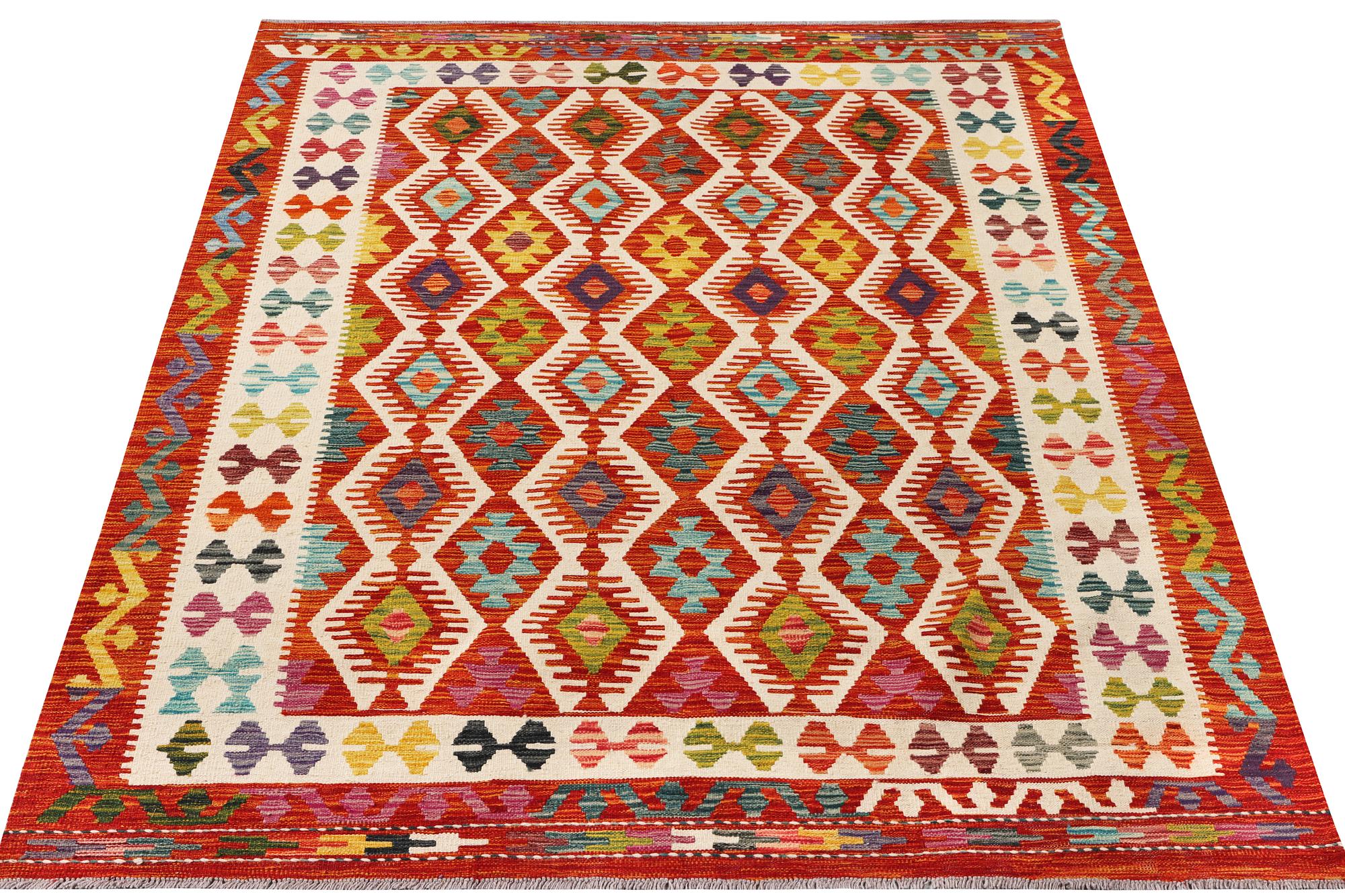 A Kilim rug, c. 242 x 181 cm.
