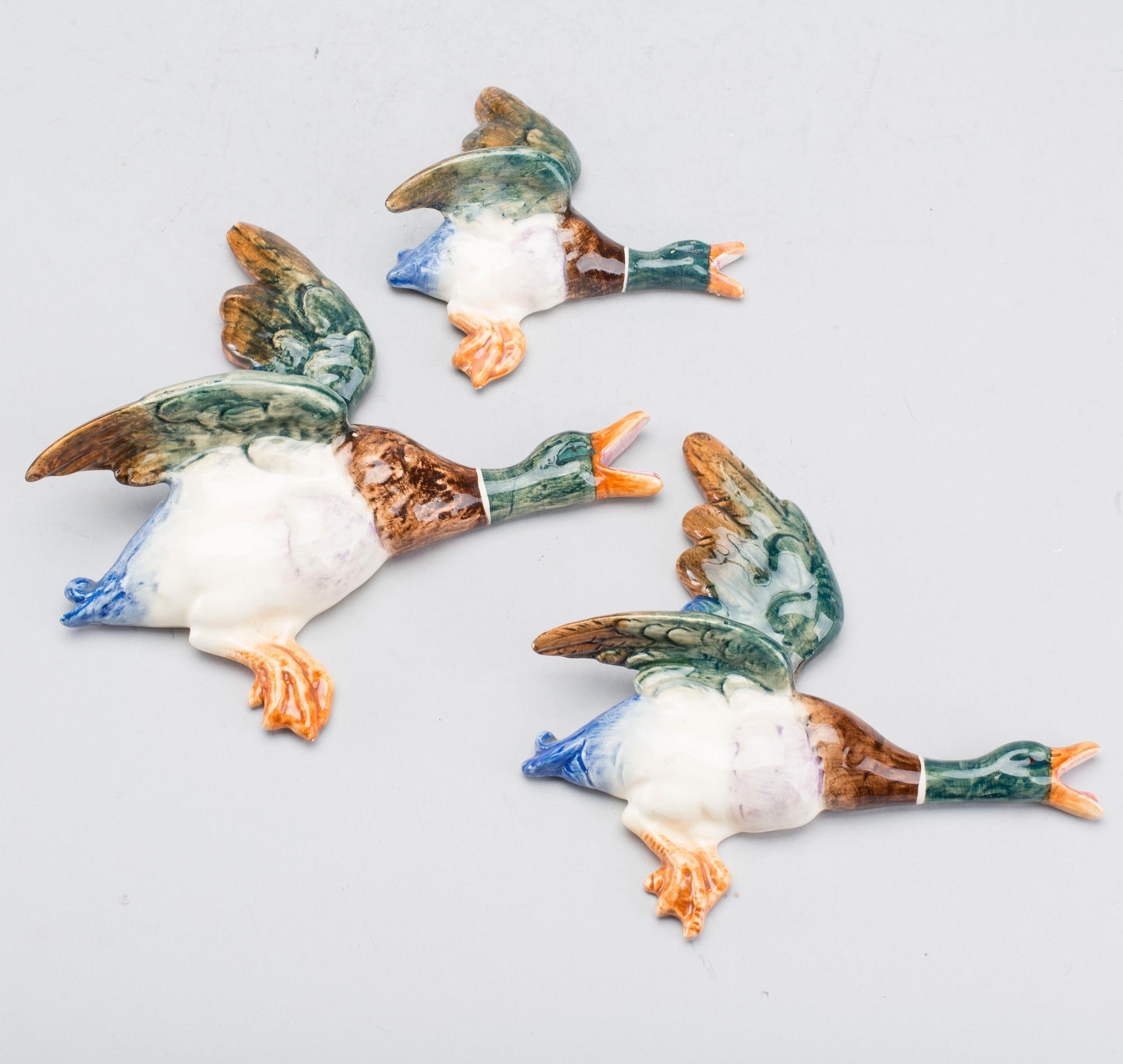 A SET OF THREE ROYAL DUX FLYING DUCKS.