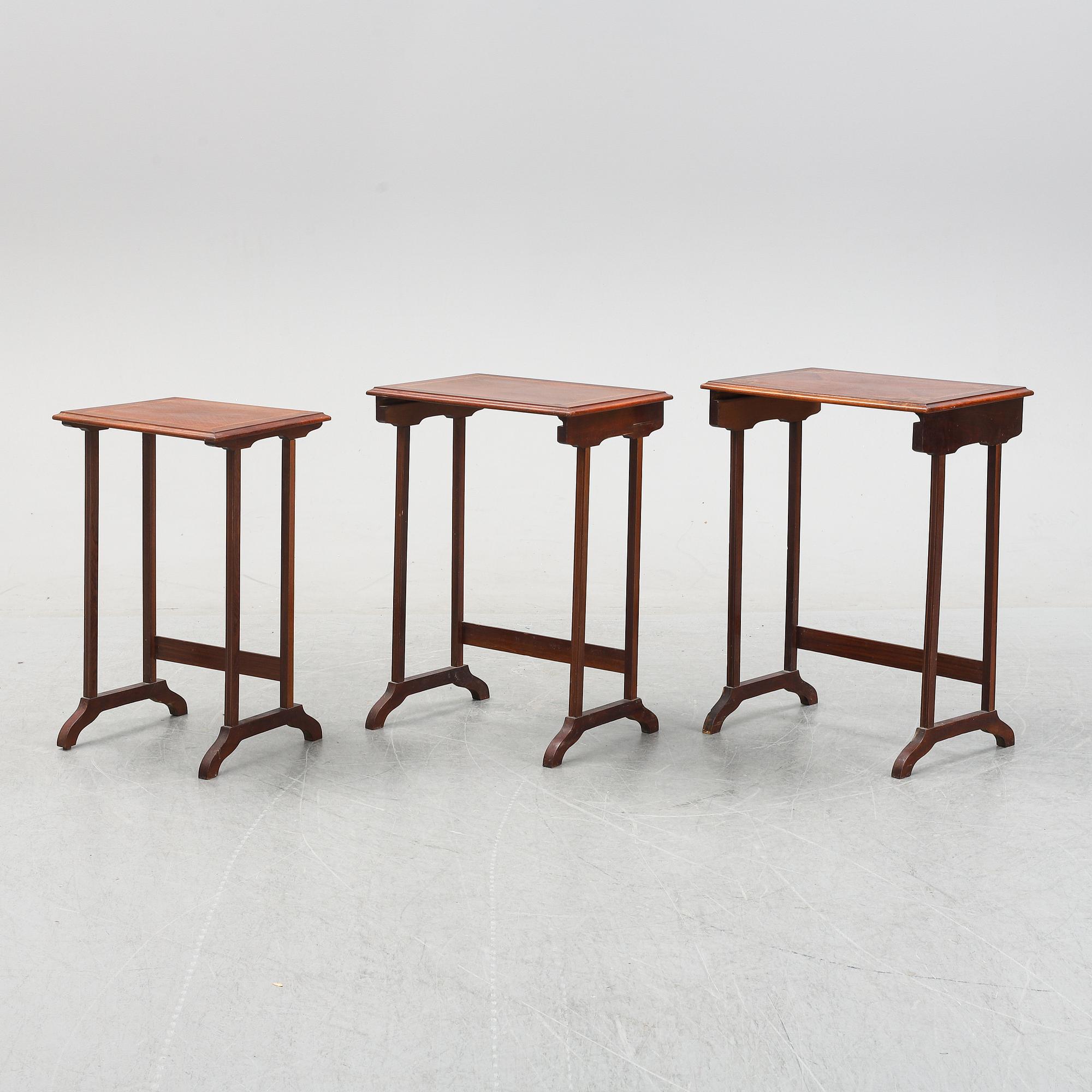 A three piece nesting table with inlay, first half of the 20th Century.