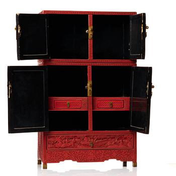 A carved  lacquer 'Kang'Cabinet, Qing dynasty, 18/19th Century.