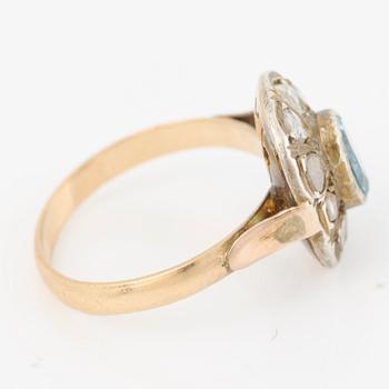 Ring in 14K gold with a faceted topaz and rose-cut diamonds.