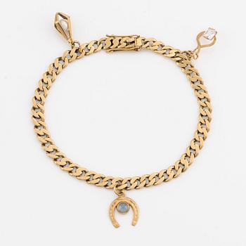 Bracelet, 18K gold, with three charms.