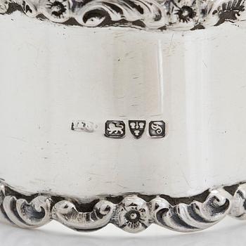 A sterling silver egg cup and napkin ring in original fitted case, Chester 1909.