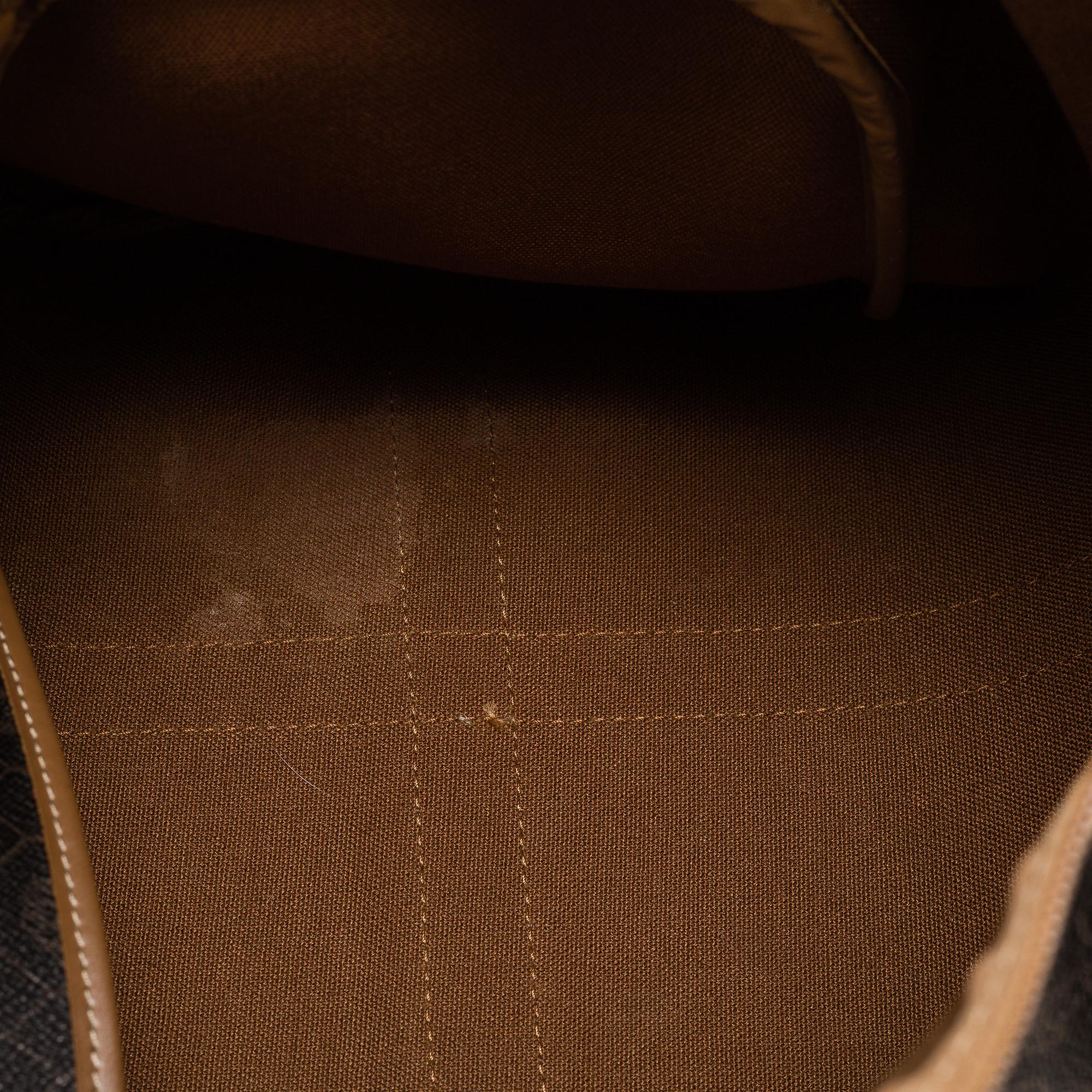 CHRISTIAN DIOR, a monogram canvas bag.