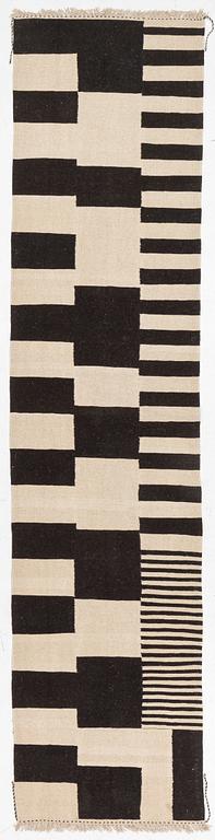 A kilim runner, c. 393 x 93 cm.