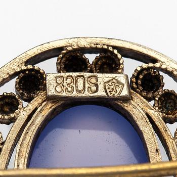 Brooch, cabochon-cut moonstones, gilded silver.