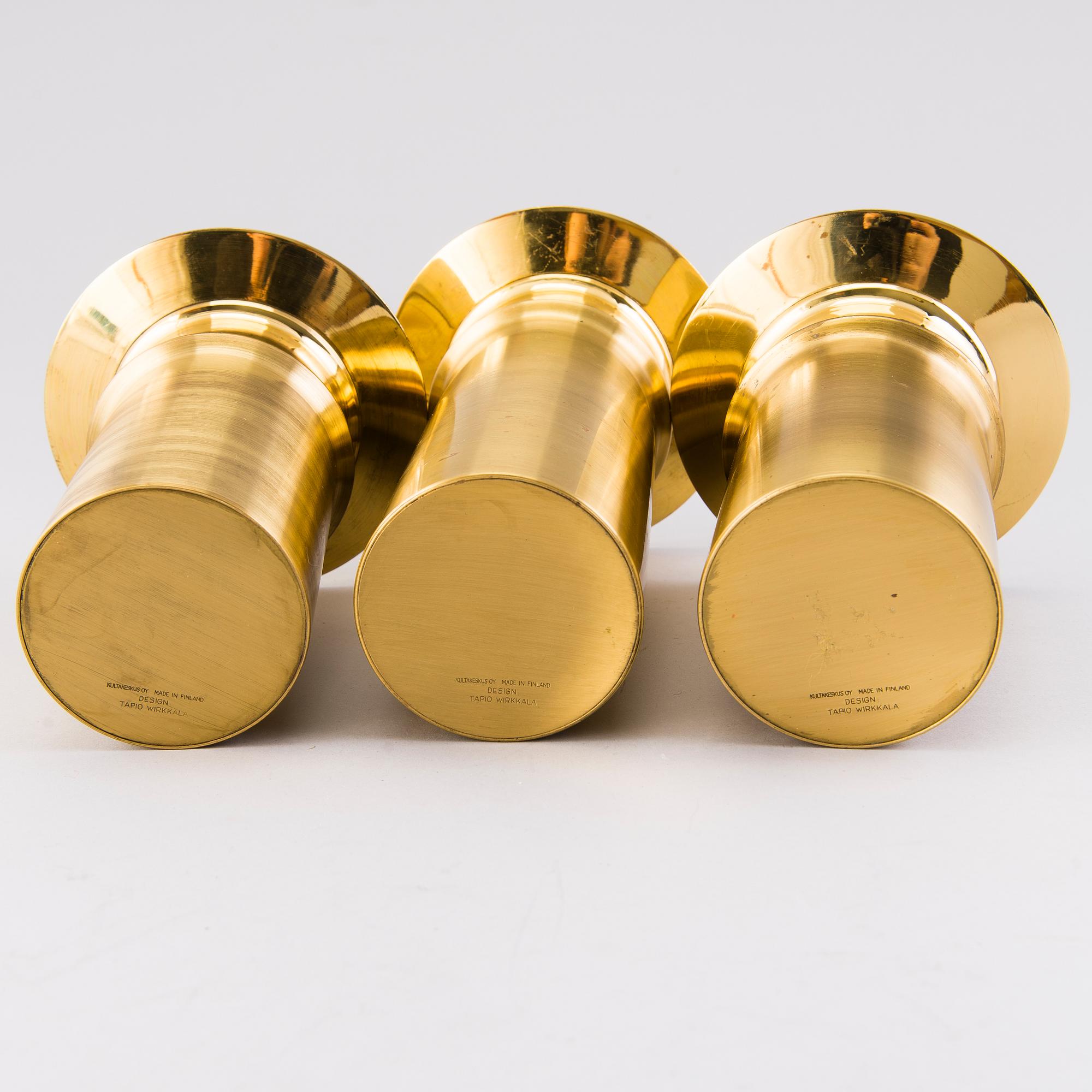 TAPIO WIRKKALA, A set of three brass candleholders, all marked Kultakeskus Oy Made in Finland, Design Tapio Wirkkala.