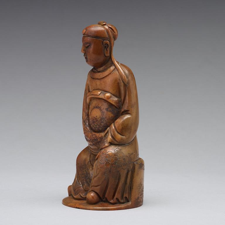 A soapstone sculpture of a mandarin official, late Qing dynasty.