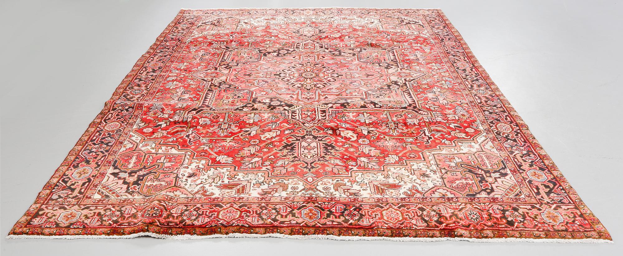 A Heriz rug, 323 x 264 cm.