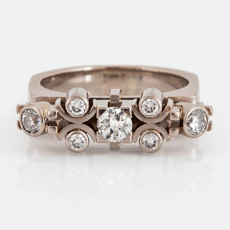 A Claës Giertta 18K white gold ring set with round brilliant-cut diamonds.