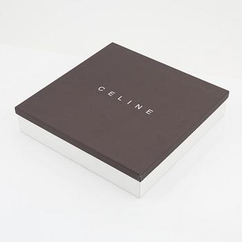 Céline, a gulden leather and metal belt, size 70.