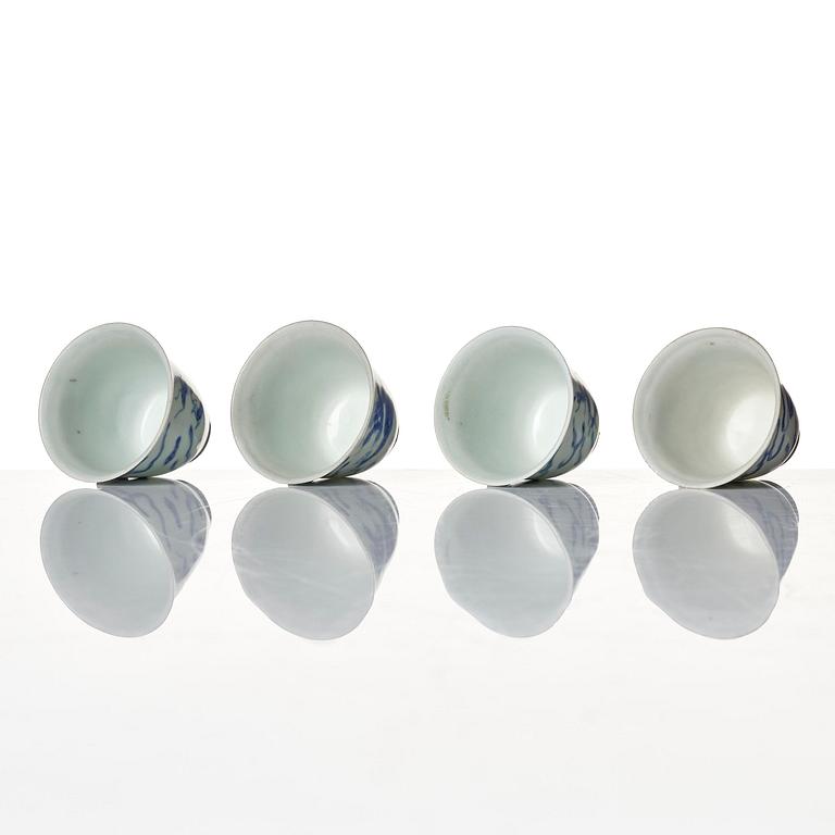 A set of four blue and white dragon wine cups, 'Hatcher Cargo', 17th century.