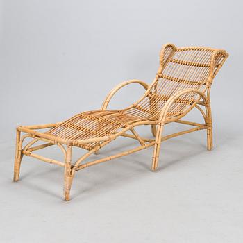 A mid-20th century rattan lounge chair.
