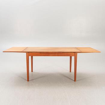 A Danish 1960s teak dining table.