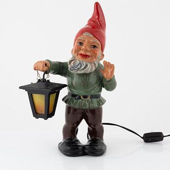 A West German earthenware gnome with lantern from the second half of the 20th century.
