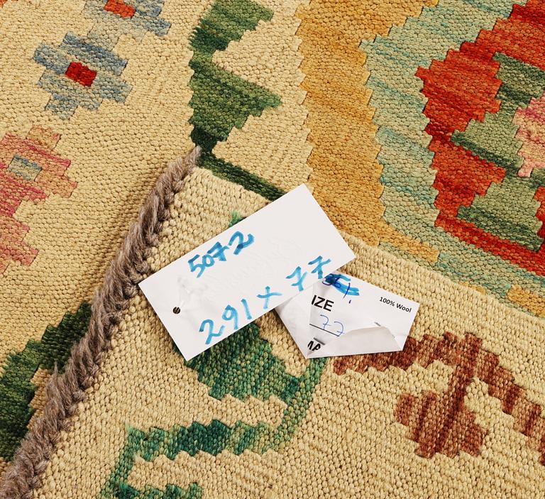 A Kilim runner carpet, c. 291 x 77 cm.