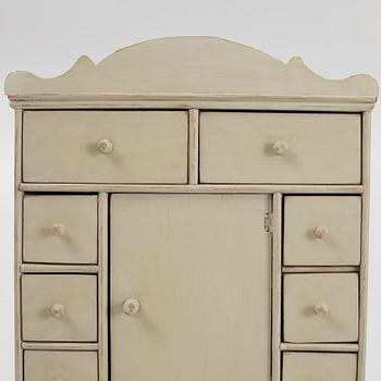 A spice cabinet, late 19th century.