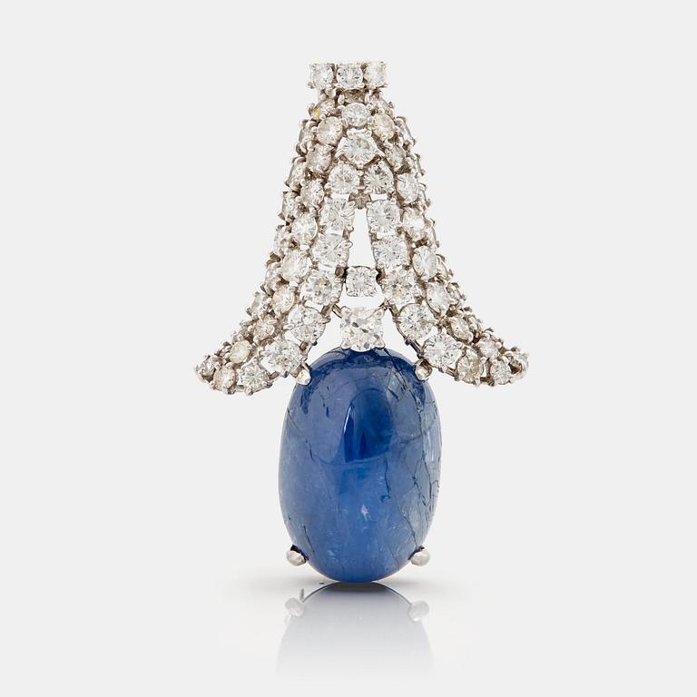 A cabochon cut Ceylon sapphire and brilliant cut diamond pendant/brooch.