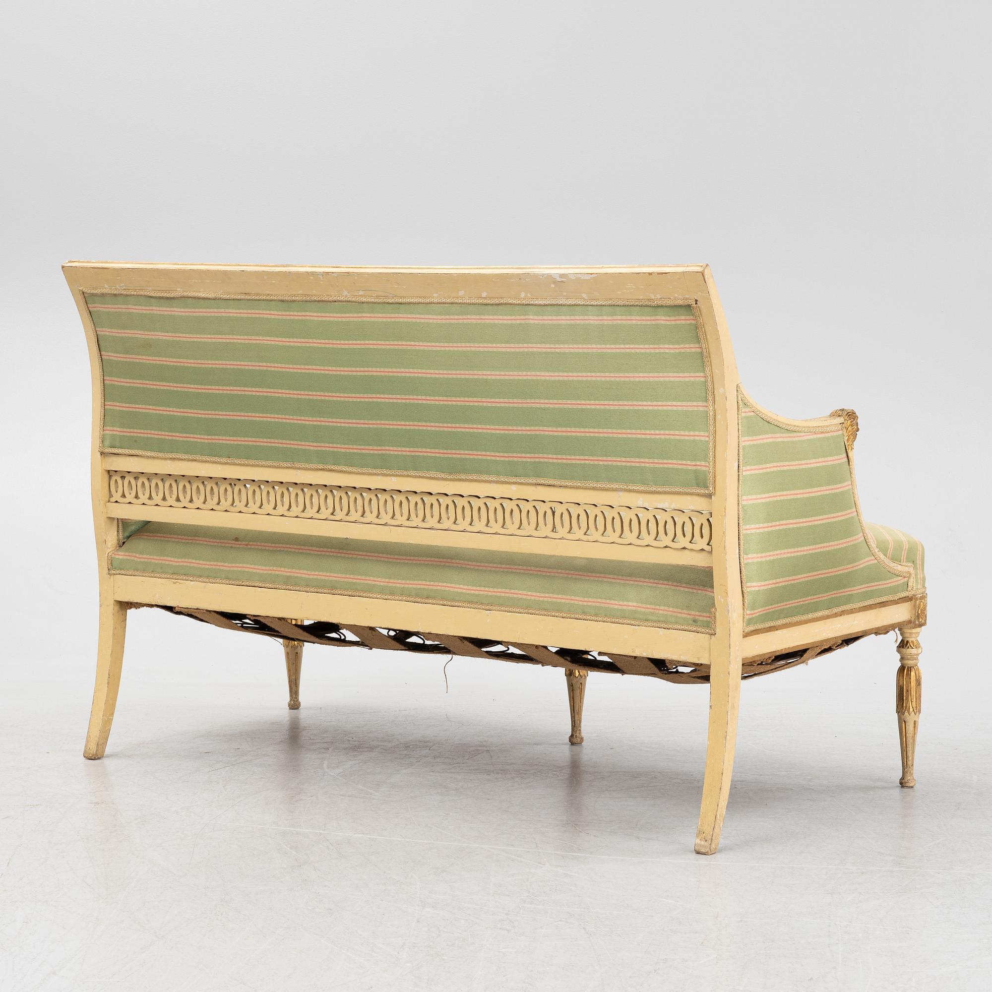 A late Gustaivan style sofa and four matched chairs from around the year 1900.