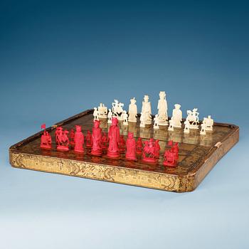 A black lacquer chess game with 32 + 38 ivory and bone figures, late Qing dynasty (1644-1912).