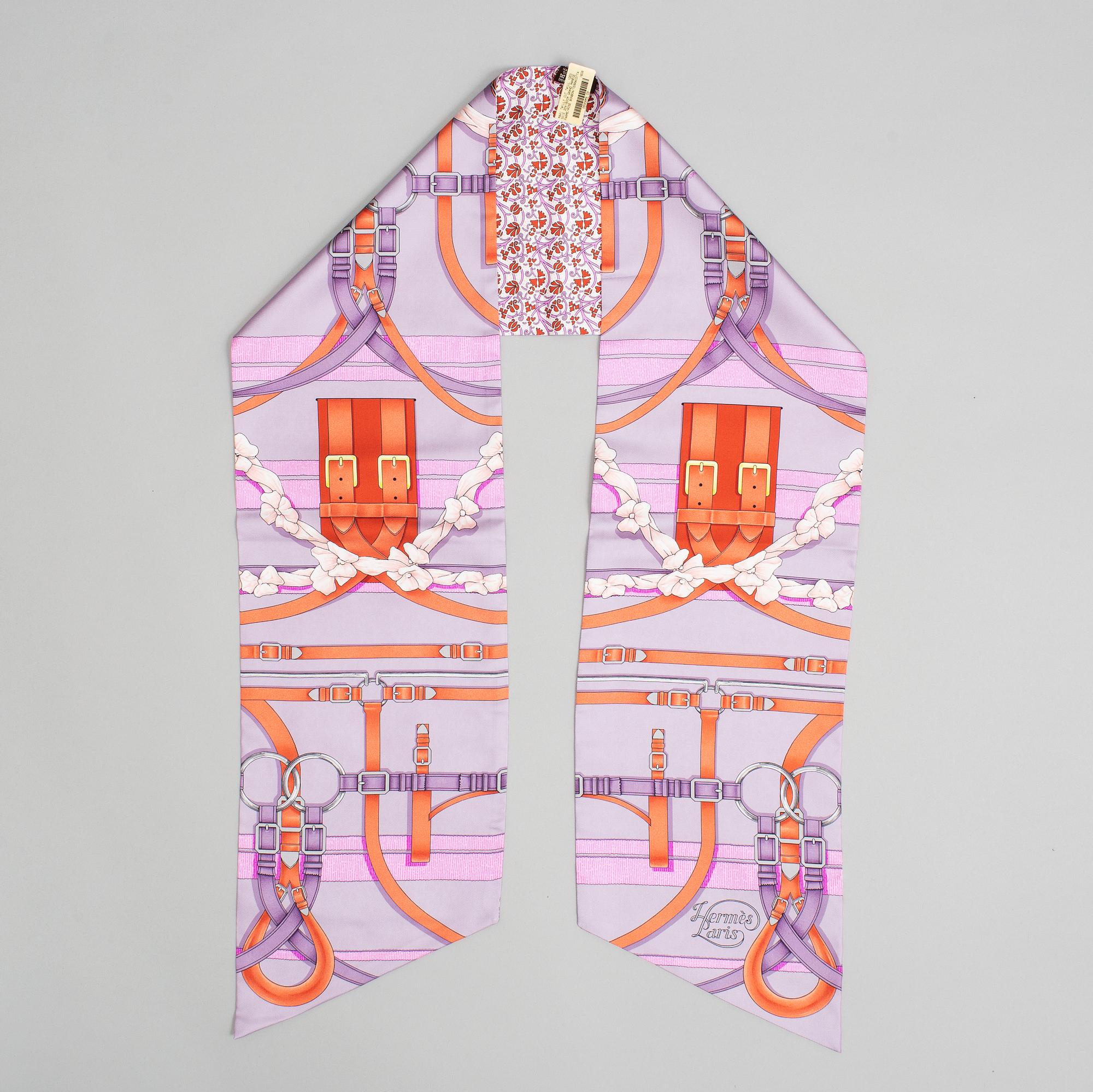 Hermès, a Maxi Twilly, 'Grand Manège' silk scarf.