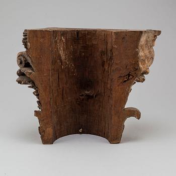 An 18th century carved wood corinthian capital.