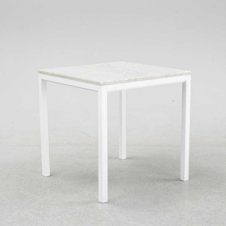 A marble top table, 21th century.