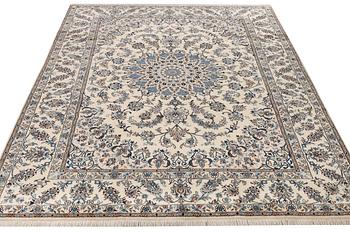 A Nain, part silk carpet, c. 337 x 244 cm.