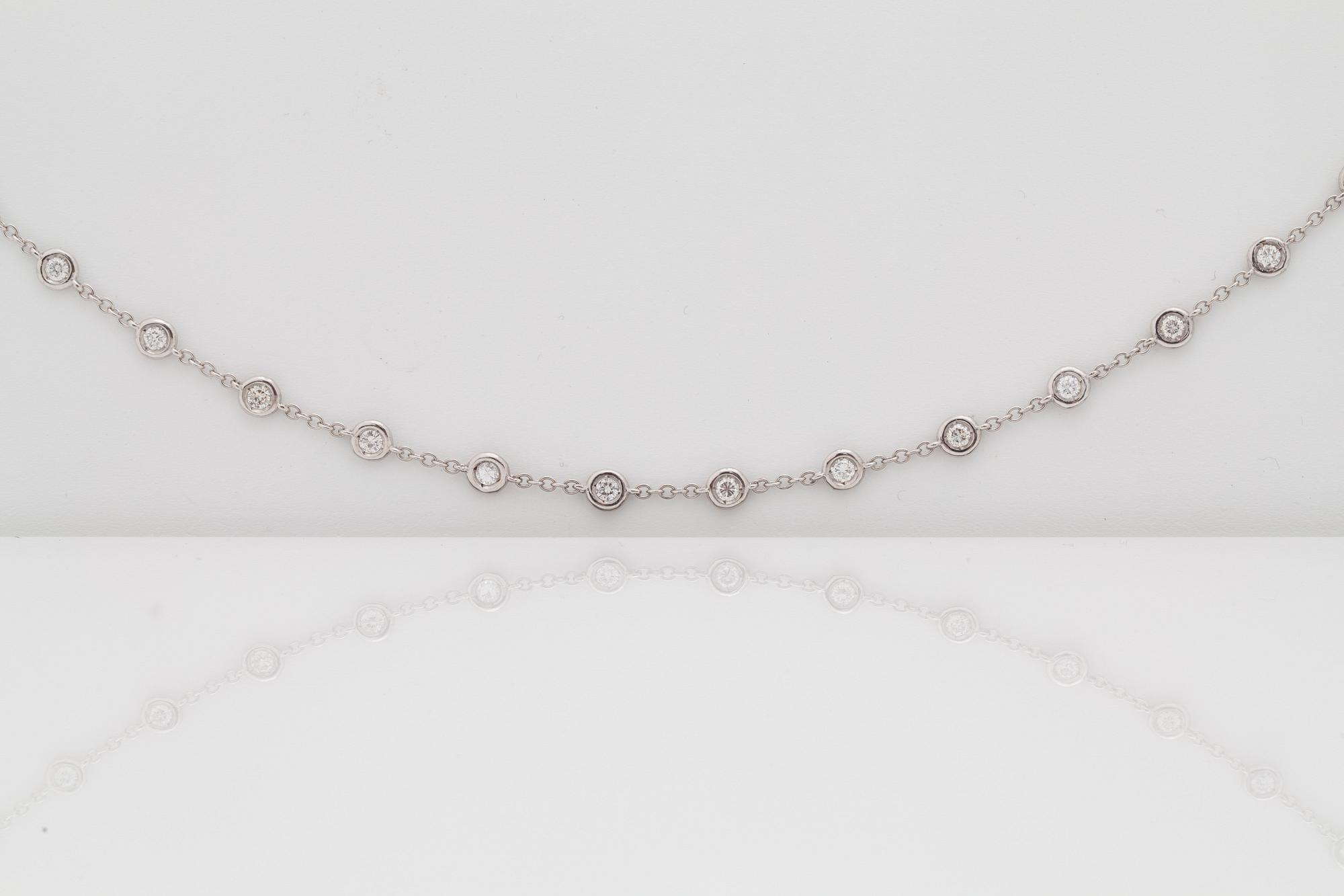 A btilliant cut diamond necklace. Total carat weight circa 4.95 cts. Quality circa H/SI.