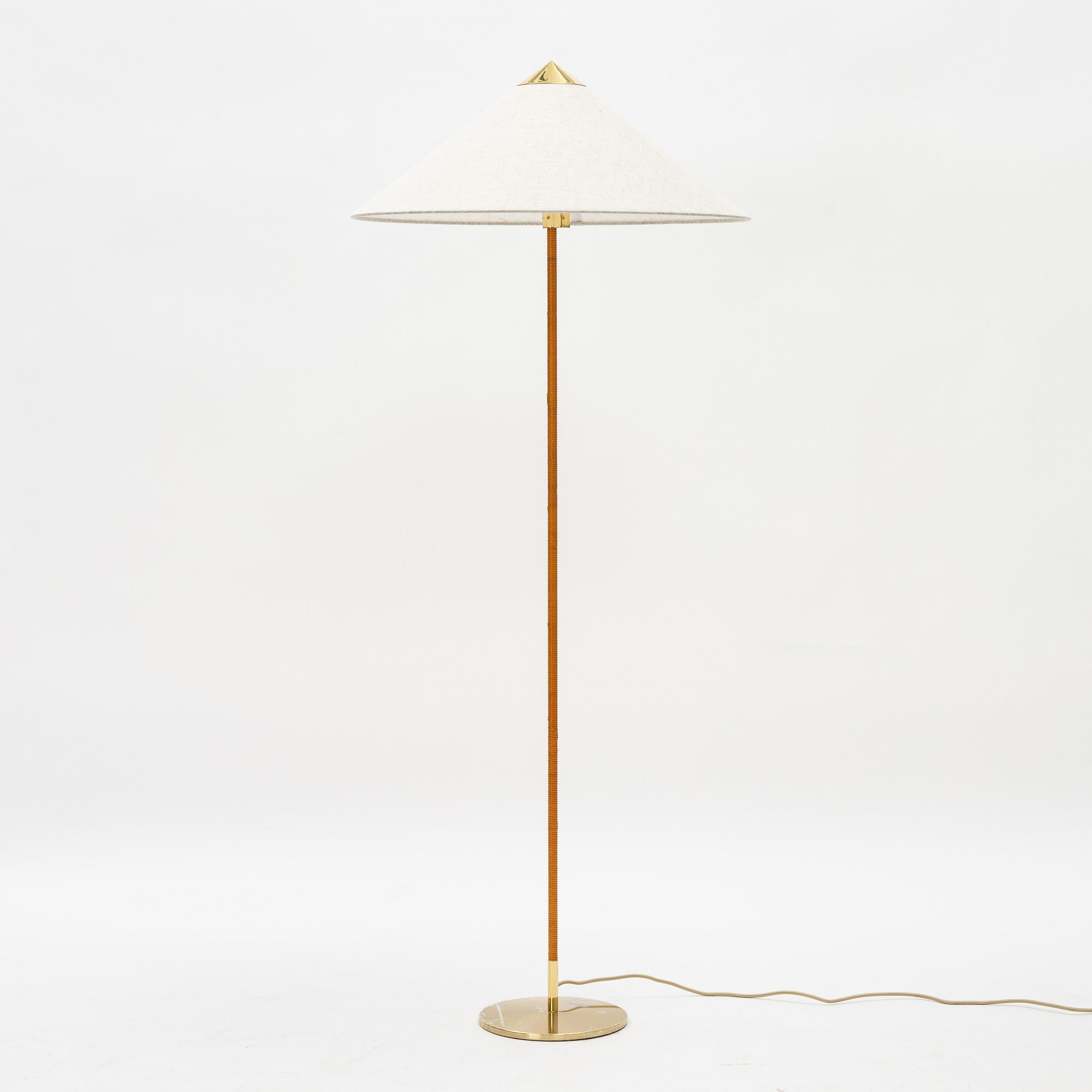 Paavo Tynell, A model 9602 brass and rattan floor lamp with canvas shade from Gubi,