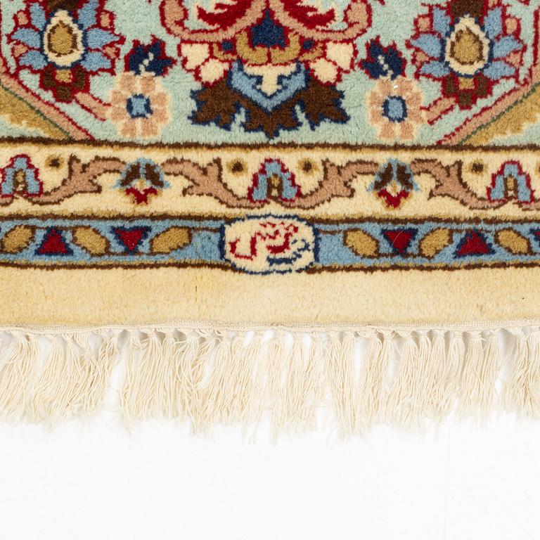 A carpet, signed, circa 286 x 212 cm.